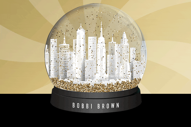 Snow globe with gold snow on a gold swirl background